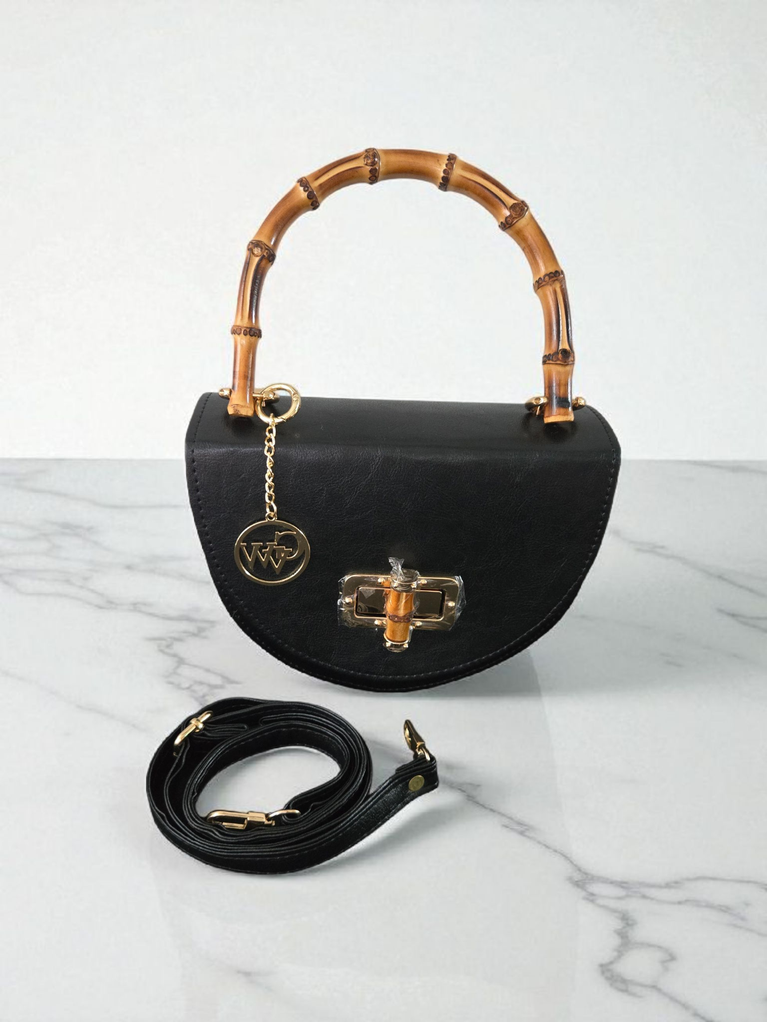 Bolso de mano de cuero elegante con asa de bambú negro y forma de media luna – Gidi Vibes Woman